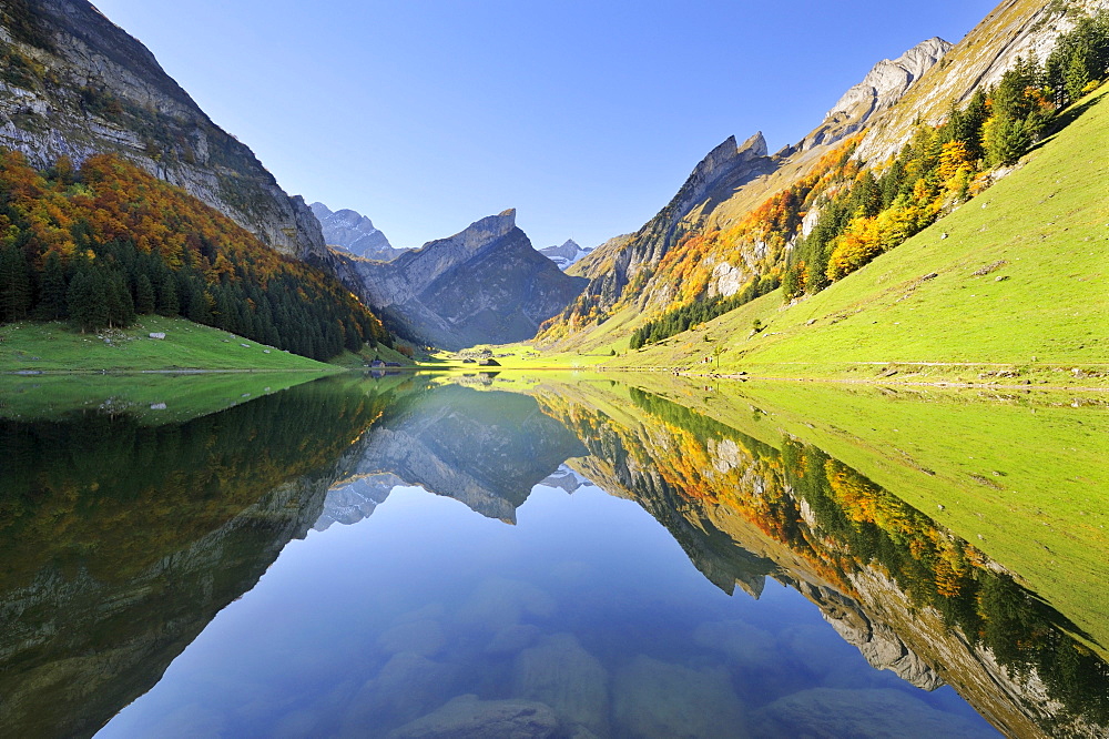 View from Seealp Lake, at 1143 m altitude, over the Seealp Mountains in autumn towards Rossmad Mountain, 2103 meters high, right behind, Saentis Mountain, to the left, Altmann Mountain, Canton of Appenzell Inner-Rhodes, Switzerland, Europe