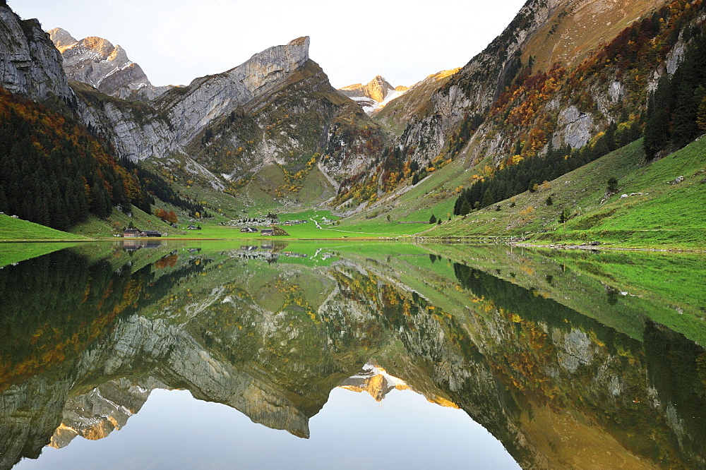 Early morning mood after sunrise looking over Seealp Lake, at 1143 m altitude, towards Rossmad Mountain, 2103 meters high, right behind, Saentis Mountain, to the left, Altmann Mountain, Canton of Appenzell Inner-Rhodes, Switzerland, Europe