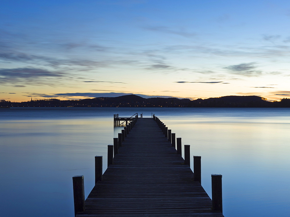 Sunrise at a jetty on lake Woerthsee, Bavaria, Germany, Europe