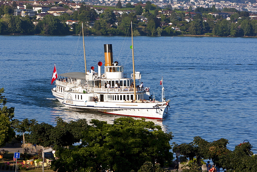 An old paddle-steamer as a ferry for tourists approaching a dock near Morges, canton of Vaud, Switzerland, Europe