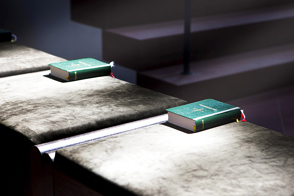 The Holy Bible on a sunny bench, Kollegiatstift Neumuenster collegiate church, Wuerzburg diocese, Kardinal-Doepfner-Platz square, Wuerzburg, Bavaria, Germany, Europe