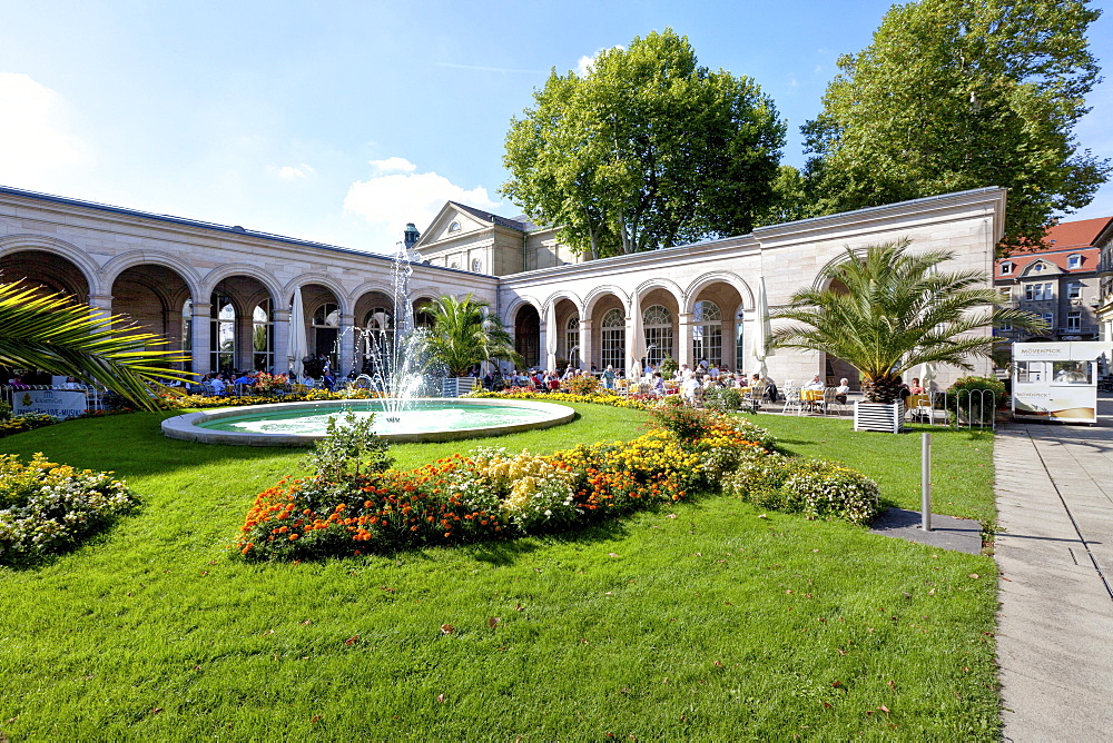 Pensioners in the Kurgarten Cafe, a cafe in a spa garden of the Kurhaus spa hotel with the Regentenbau building and arcade halls, Bad Kissingen, Lower Franconia, Bavaria, Germany, Europe