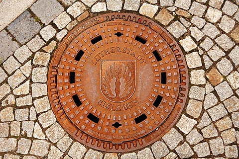 Manhole cover with the coat of arms of Eisleben, Saxony-Anhalt, Germany, Europe