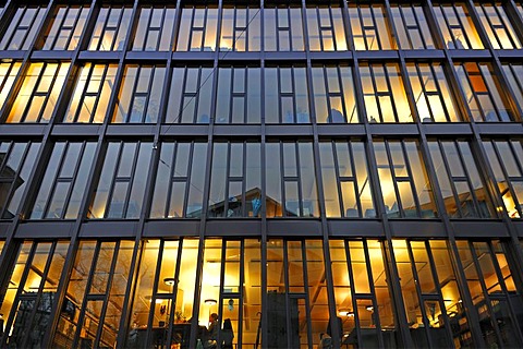 Lit offices of an office building in the evening, Dufour Street, Basel, Switzerland, Europe