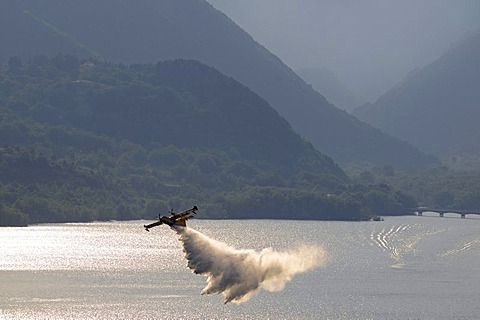 Fire fighting aircraft training on Lake Lago di Barrea, Abruzzo, Italy, Europe