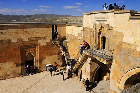 Tourists in the Sarihan caravanserai, Cappadocia, Turkey, Western Asia