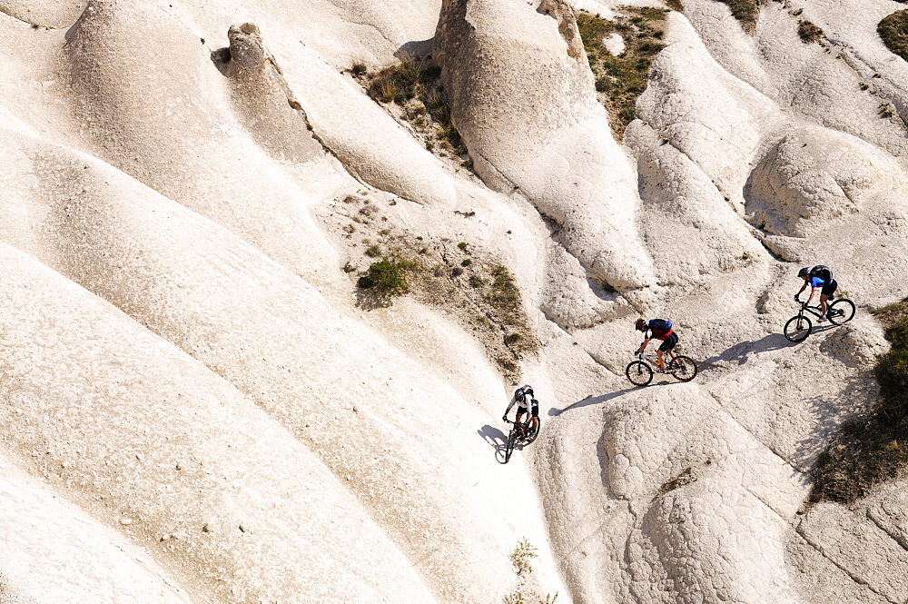 Mountain bikers cycling in Goereme, Cappadocia, Turkey