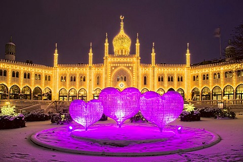 Pink Christmas hearts in front of restaurant Nimb in Tivoli, Copenhagen, Denmark, Europe