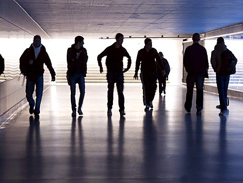 Group of youths passing through a dark underpass