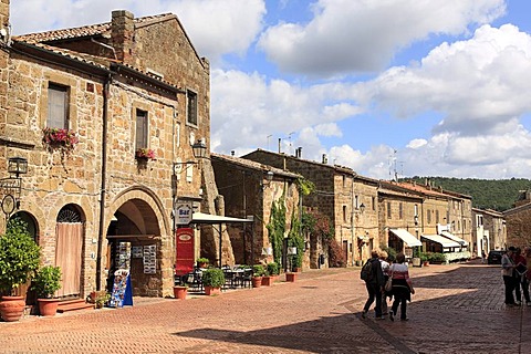 The Palazzo Pretorio, 13th century, on the left, street and tourists in medieval village of Sovana, Province of Grosseto, Tuscany, Italy, Europe