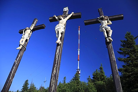 The three Golgotha crosses on Kreuzberg mountain, in the back the mast of the Sender Kreuzberg station, Bischofsheim, Landkreis Rhoen-Grabfeld district, Lower Franconia, Bavaria, Germany, Europe