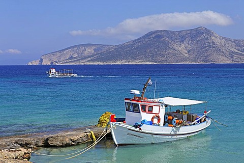 Fishing boat on Koufonisi island, Kato Koufonisi in the back, Cyclades, Aegean Sea, Greece, Europe