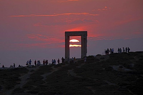 Sunset, Portara or gate of the Temple of Apollo, Naxos town, Naxos island, Cyclades, Aegean Sea, Greece, Europe