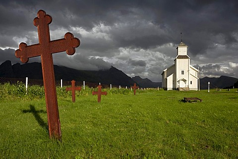 Cemetery and church near Hov in the evening light on the Lofoten Islands, Norway, Europe