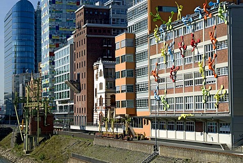 Varied colourful architecture with the Flossies installation by Rosalie in the foreground, Medienhafen media harbour, Duesseldorf, North Rhine-Westphalia, Germany, Europe