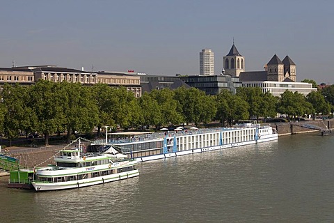 Passenger ships on the bank of the Rhine river, St. Kunibert church, Cologne, North Rhine-Westphalia, Germany, Europe