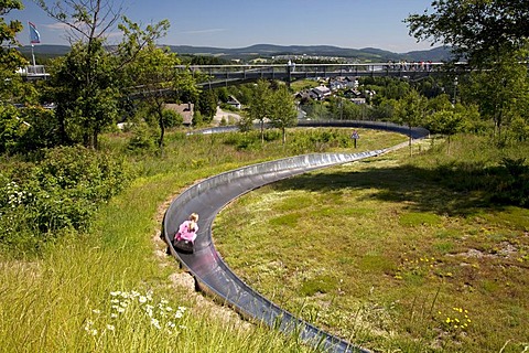 Summer toboggan run and panoramic bridge at the Erlebnisberg Kappe recreational park, Winterberg, Sauerland, North Rhine-Westphalia, Germany, Europe