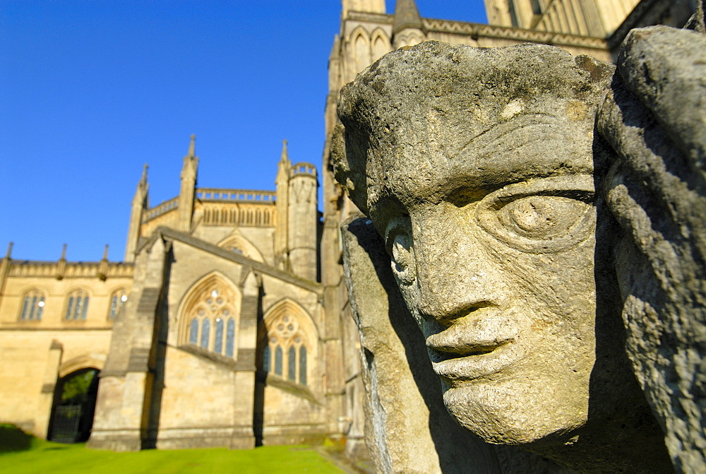 Stone face on Wells Cathedral, Wells, Somerset, England, United Kingdom, Europe