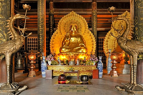 Buddha statue, the largest and heaviest bronze statue in Vietnam inside the Chua Bai Dinh pagoda, currently a construction site, to become one of the largest pagodas in Southeast Asia, near Ninh Binh, Vietnam, Southeast Asia