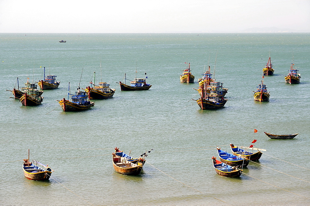 Fishing boats in the fishing port of Mui Ne on the South China Sea, South Vietnam, Southeast Asia