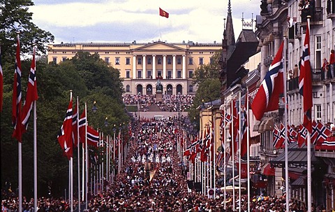 Main street Karl Johan with flags and people in front of the royal palace, celebration of the National day, May 17, Oslo, Norway, Europe