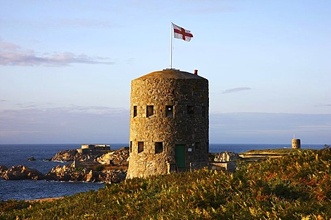 Martello towers, watch and guard towers from the 17th century found along the coastline, here Tower No. 5 at Pembroke Bay in the northeast of Guernsey, Channel Islands, Europe