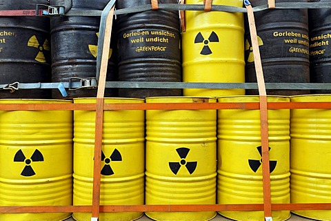 Symbolic nuclear waste barrels stacked on a loading platform, anti-nuclear demonstration against the Gorleben disposal site, Lueneburg, Lower Saxony, Germany, Europe