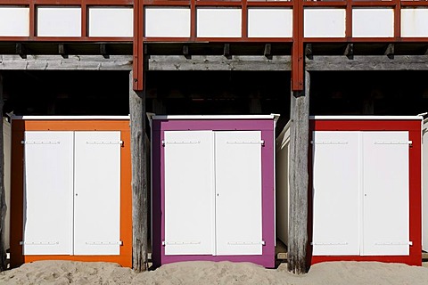 Three coloured beach huts with white doors, Westkapelle, Walcheren peninsula, Zeeland province, Netherlands, Benelux, Europe