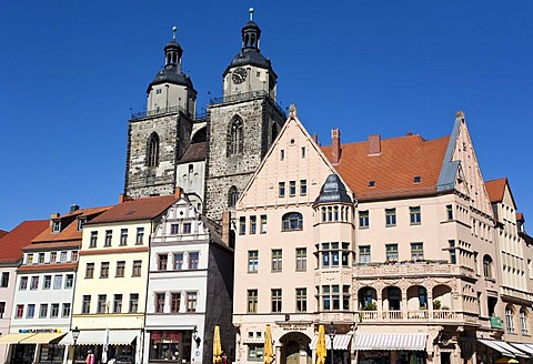 Towers of the church of St. Marien and restored houses in Lutherstadt Wittenberg, Saxony-Anhalt, Germany, Europe