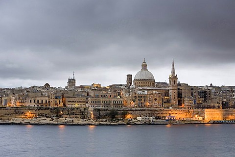 View of Sliema with St. Paul's Cathedral and Carmelite Church at dusk, Marsamxett Harbour, Valletta, Malta, Europe