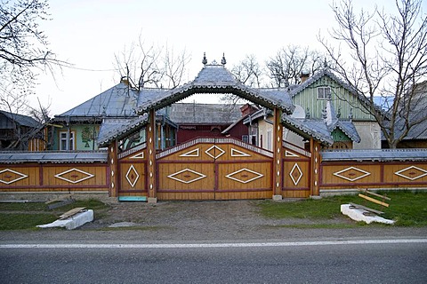 Gate of a farm at the DN 2E, Cornu Luncii, Romania, Europe