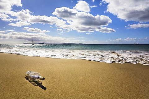 Message in a bottle on a beach, Papagayo beach, Lanzarote, Canary Islands, Spain, Europe