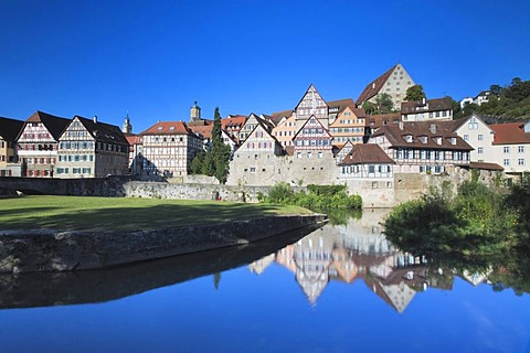 Rows of houses in the historic centre of Schwaebisch Hall, reflected in Kocher River, Hohenlohe, Baden-Wuerttemberg, Germany, Europe