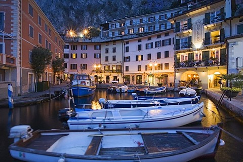 Illuminated promenade at the port of Limone in the evening, Lake Garda, Lombardy, Italy, Europe