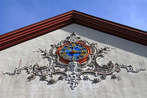 Ornamental clock framed with stucco work on the facade of Buergeln Castle, built by Franz Anton Bagnato in 1762, early Classicism style, Schliengen, Baden-Wuerttemberg, Germany, Europe