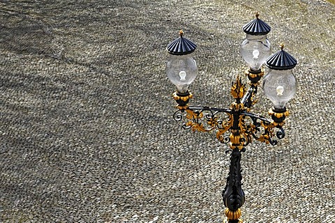 Three-armed ornate lamp on the paved palace square at Buergeln Castle, built around 1762, Schliengen, Baden-Wuerttemberg, Germany, Europe