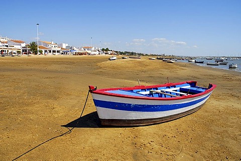 Boat at the Rio Piedras river, ebb tide at the beach in El Rompido, Cartaya, Costa de la Luz, Huelva region, Andalucia, Spain, Europe