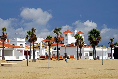 Alameda with church and palm trees on the beach, La Antilla, Costa de la Luz, Huelva region, Andalusia, Spain, Europe