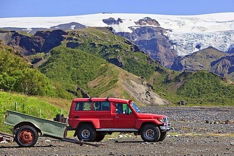 Red Jeep in a river bed near the Eyjafjallajoekull glacier, Borsmoerk, Iceland, Europe