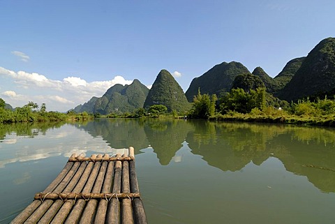 Bamboo raft on the Yulong river in the karst landscape near Yangshuo, Guilin, Guangxi, China, Asia