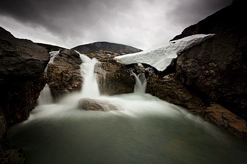 Waterfall in bad weather in the Fjaell Mountains, Sweden, Europe