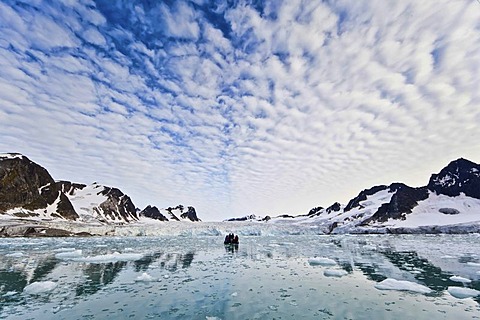 Ice, fjord, Zodiac rubber boat in the Fuglefjord in front of a glacier, Svalbard, Spitsbergen, Norway