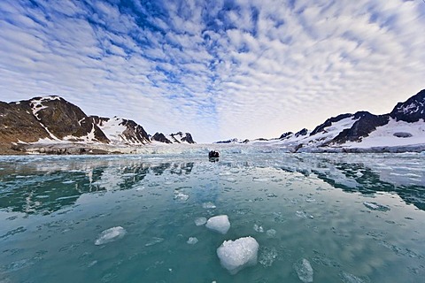 Ice, fjord, Zodiac rubber boat in the Fuglefjord in front of a glacier, Svalbard, Spitsbergen, Norway