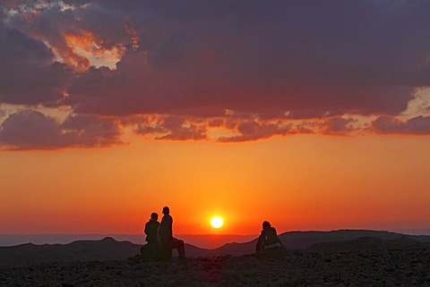 People watching the sunset over the desert, landscape in the Dana Biosphere Reserve near Feynan, Hashemite Kingdom of Jordan, Middle East