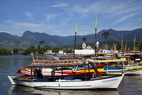 Chapel of Santa Rita and colourful boats in colonial town of Paraty, Costa Verde, State of Rio de Janeiro, Brazil, South America