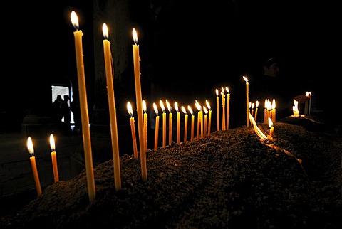 Candles burning in the Armenian orthodox church at Geghard monastery near Garni, UNESCO World Heritage Site, Kotayk region, Armenia, Asia