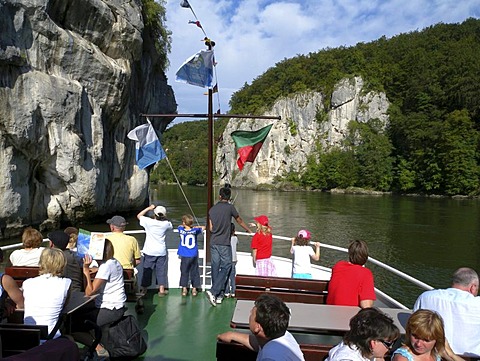 People on the deck of a passenger ship, gap of danube river, near Weltenburg, Altmuehltal Nature Park, Bavaria, Germany, Europe