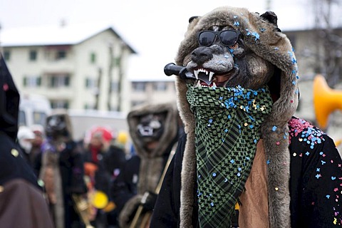 The Guggenmusik Ruopige Hoepfer group dressed in the theme of wolf tracks during the carnival procession in Littau, Lucerne, Switzerland, Europe