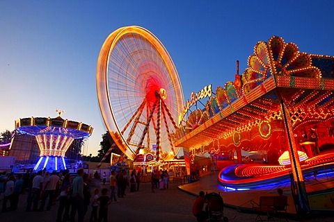 Ferris wheel, chairoplane, bumper cars, evening mood, folk festival, Muehldorf am Inn, Bavaria, Germany, Europe