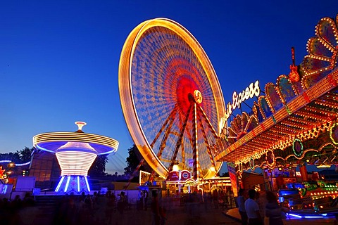 Ferris wheel, chairoplane, bumper cars, evening mood, folk festival, Muehldorf am Inn, Bavaria, Germany, Europe